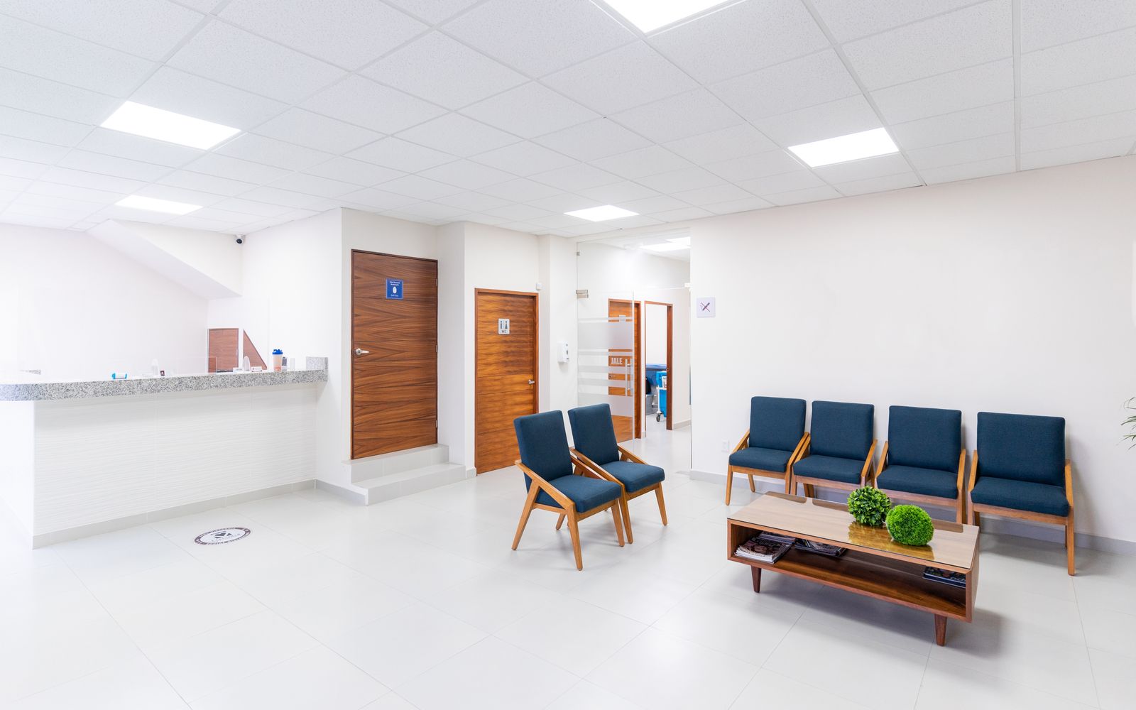 Reception desk and waiting area with seating
