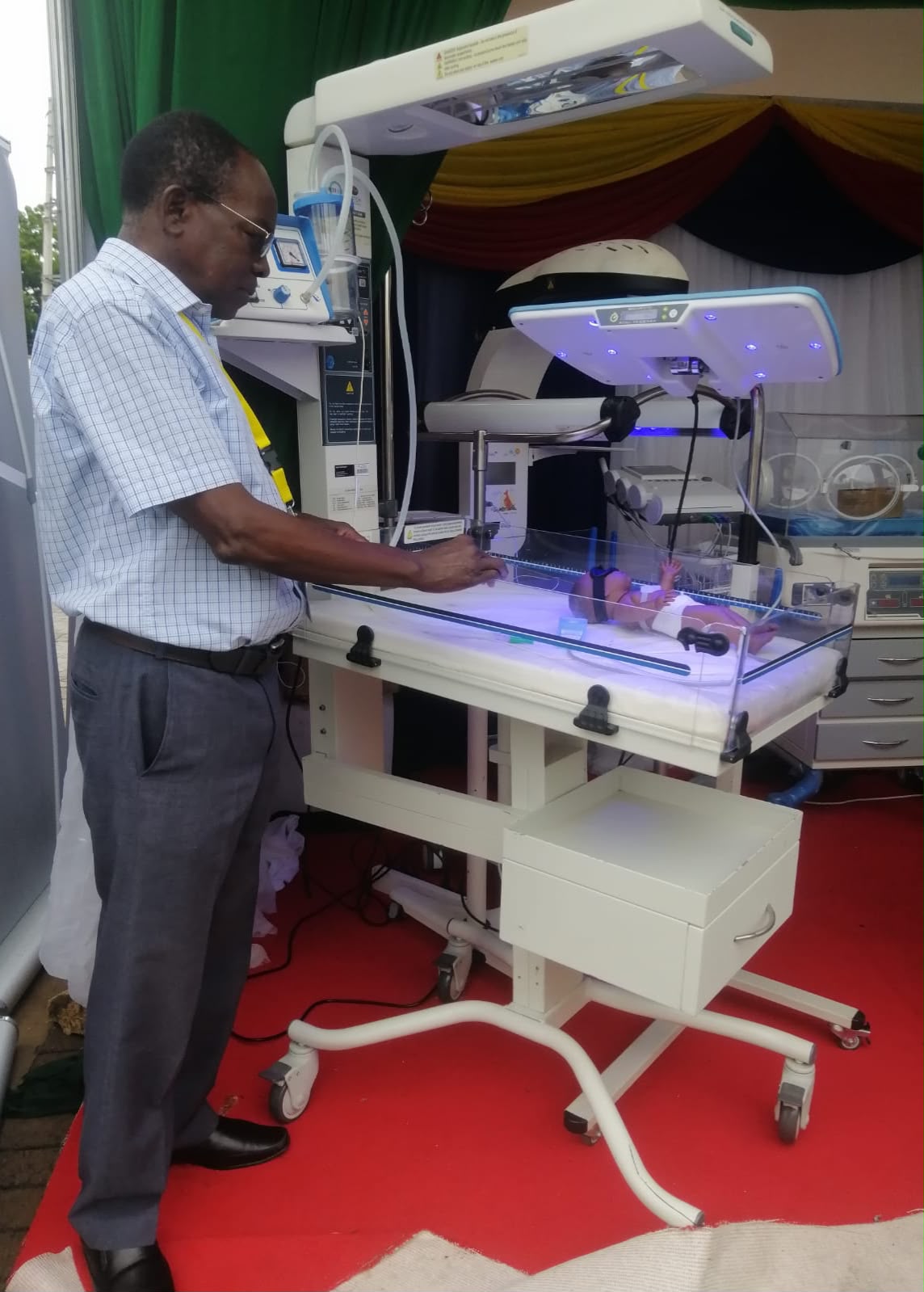 Dr. Alfred Shiroya, the centre's founder, at a newborn warmer and phototherapy unit